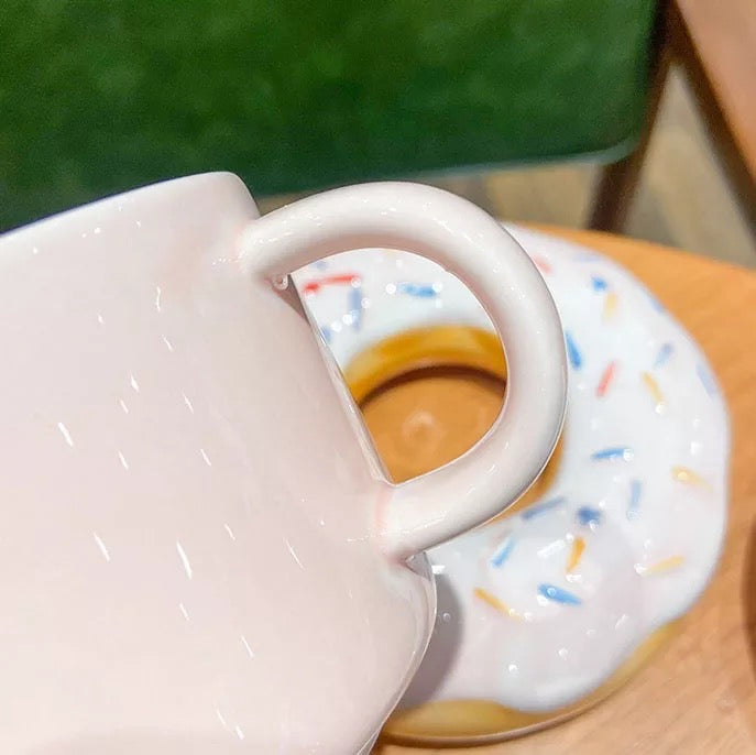 Close up of a pink doughnut mug